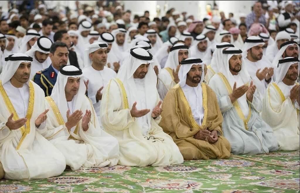 some prayers are praying in one of the UAE's mosque.