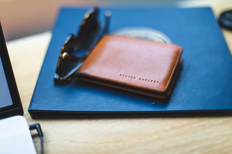 Identify the genuine leather wallet