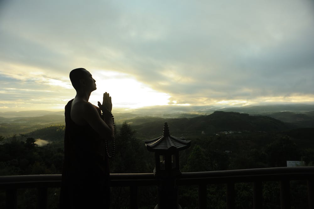 A monk praying and practicing spirituality