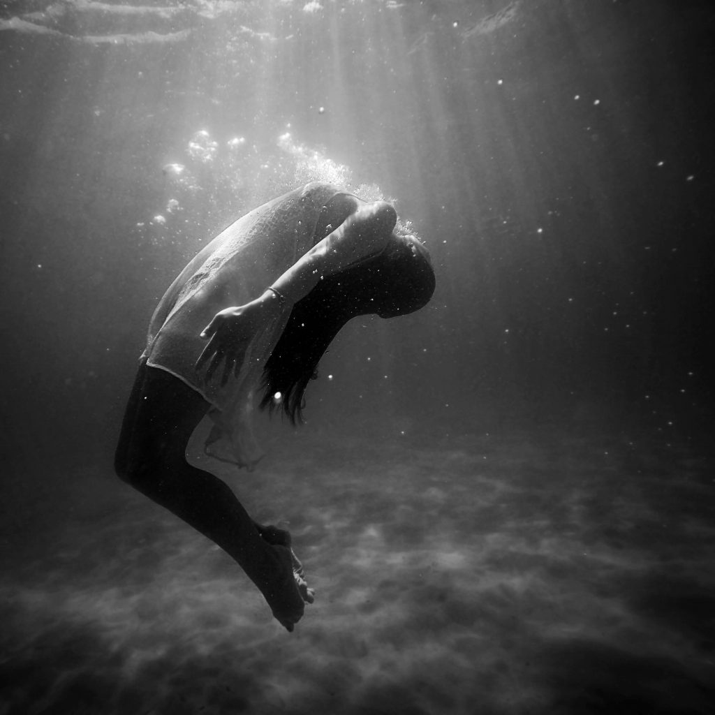 sad woman under water