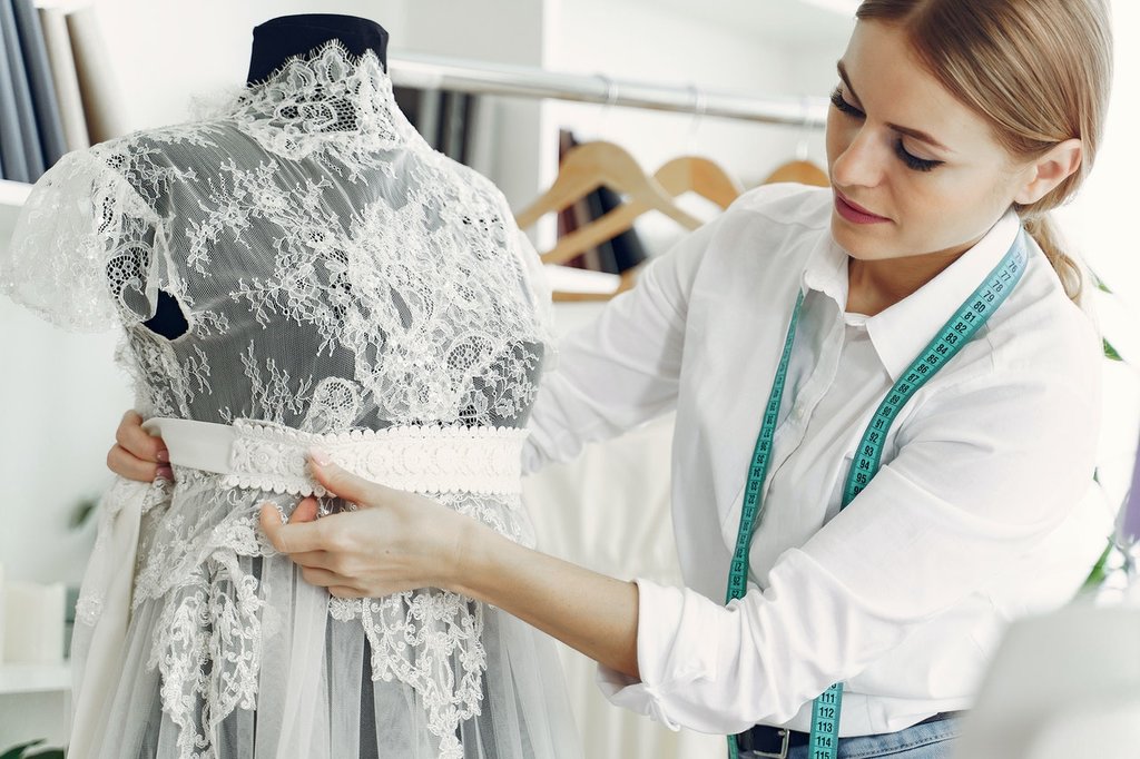 A dressmaker or designer making a dress sample 