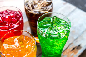 four glasses of sugar sweetened drinks